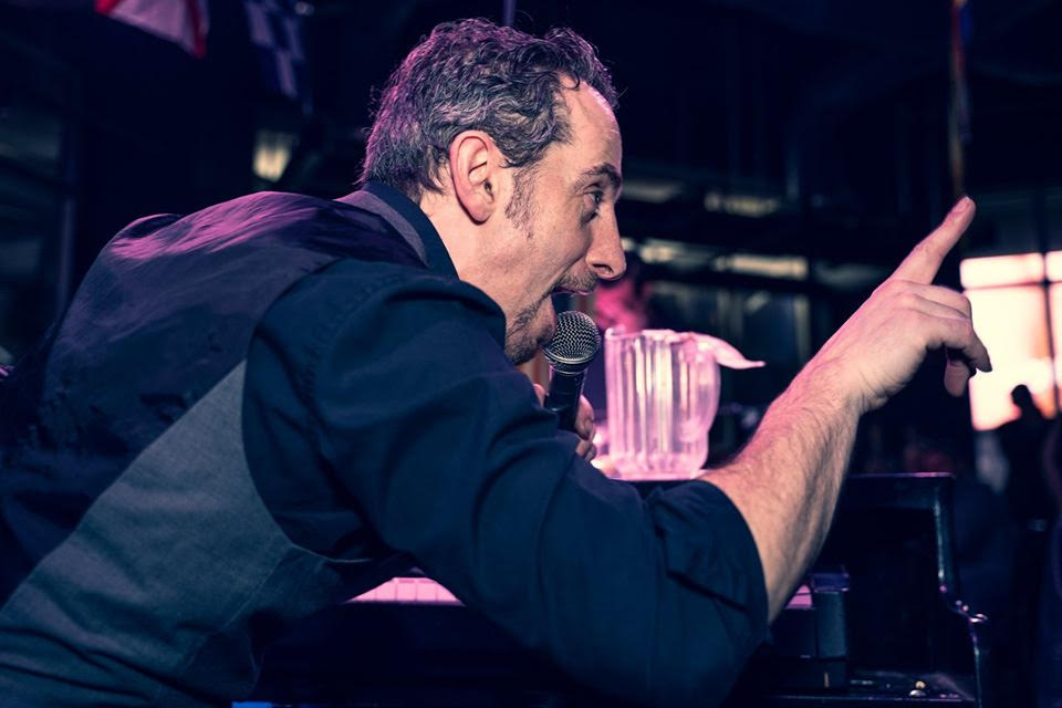 Mark Weiser drops knowledge on the crowd during a Dueling Pianos show.